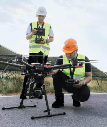 SRM technicians setting up drone